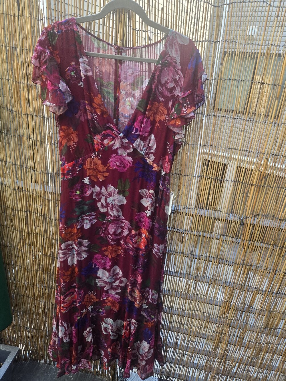 BHLDN fluttersleeve plunging maxi dress features a burgundy floral pattern 12nwt